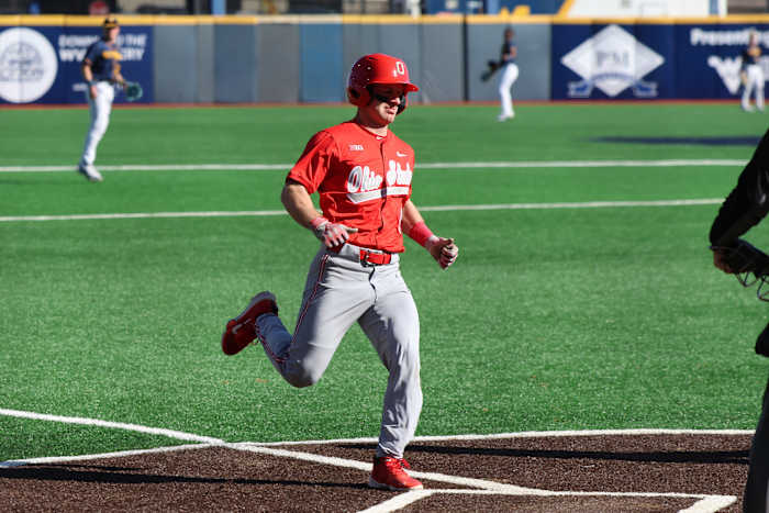 Ohio State senior Joseph Mershon crosses home plate in the first inning.